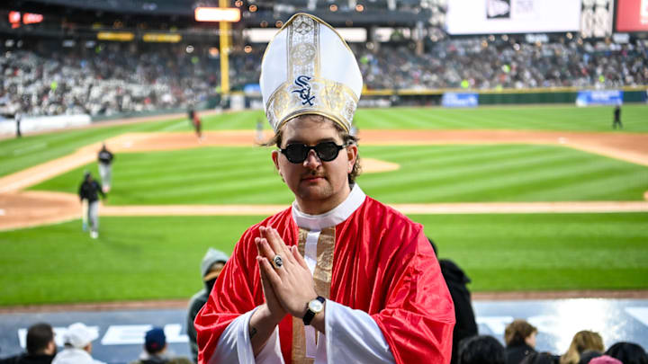 A White Sox fan dressed as the pope attends a game against the Miami Marlins.