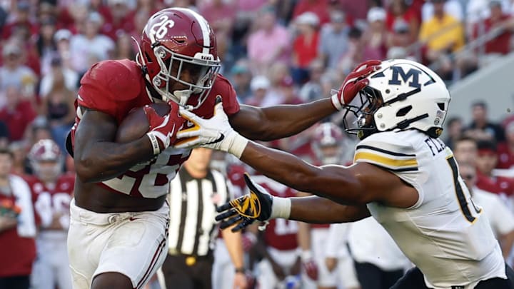 Oct 26, 2024; Tuscaloosa, Alabama, USA; Alabama Crimson Tide running back Jam Miller (26) stiff arms Missouri Tigers linebacker Corey Flagg Jr. (11) as he carries the ball in for a touchdown during the second half at Bryant-Denny Stadium. Mandatory Credit: Butch Dill-Imagn Images Oct 26, 2024; Tuscaloosa, Alabama, USA; Alabama Crimson Tide running back Jam Miller (26) stiff arms Missouri Tigers linebacker Corey Flagg Jr. (11) as he carries the ball in for a touchdown during the second half at Bryant-Denny Stadium. Mandatory Credit: Butch Dill-Imagn Images