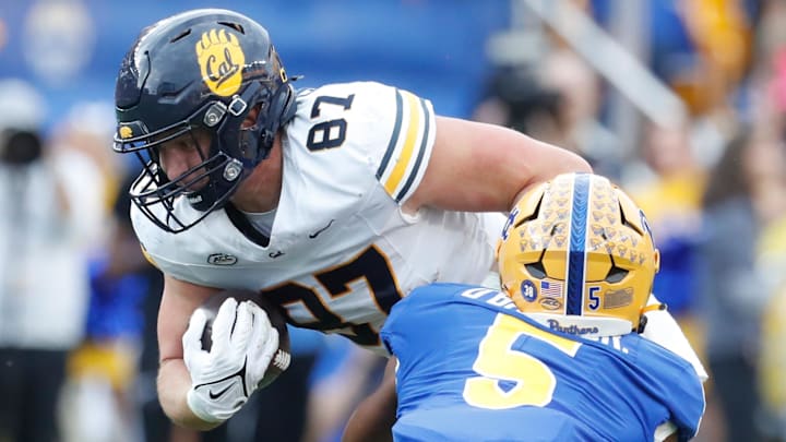 Oct 12, 2024; Pittsburgh, Pennsylvania, USA;  California Golden Bears tight end Jack Endries (87) runs after a catch as Pittsburgh Panthers defensive back Phillip O'Brien Jr. (5) defends during the second quarter at Acrisure Stadium. Mandatory Credit: Charles LeClaire-Imagn Images