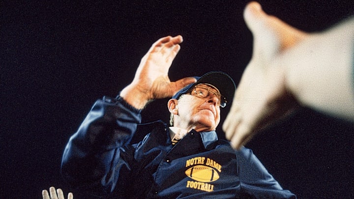Lou Holtz celebrates Notre Dame’s 1989 Fiesta Bowl win over West Virginia. The legendary coach died Wednesday at age 89.