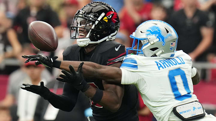 Arizona Cardinals receiver Marvin Harrison Jr. (18) tries to catch the ball as Detroit Lions cornerback Terrion Arnold (0) deflects it away at State Farm Stadium in Glendale, Ariz., Sep 22, 2024. Arizona Cardinals receiver Marvin Harrison Jr. (18) tries to catch the ball as Detroit Lions cornerback Terrion Arnold (0) deflects it away at State Farm Stadium in Glendale, Ariz., Sep 22, 2024.