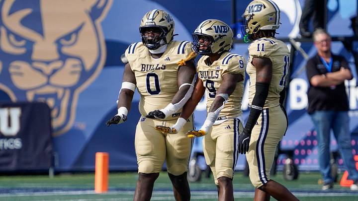 West Boca defenders Jamar Thompson (0), Grant Edmond (9), and Demetrius Geathers Jr. (11) celebrate a sack against West Broward in the second quarter of the 6A State Final at Pitbull Stadium on Dec. 12, 2025, in Miami, FL. West Boca defenders Jamar Thompson (0), Grant Edmond (9), and Demetrius Geathers Jr. (11) celebrate a sack against West Broward in the second quarter of the 6A State Final at Pitbull Stadium on Dec. 12, 2025, in Miami, FL.