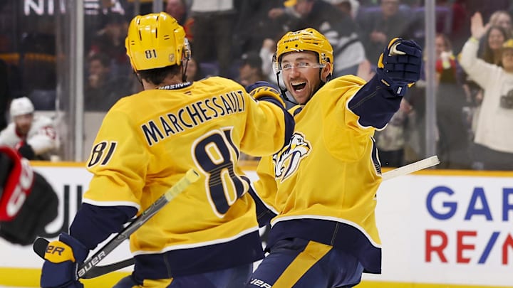 Jan 22, 2026; Nashville, Tennessee, USA;  Nashville Predators center Jonathan Marchessault (81) celebrates goal with left wing Michael Bunting (58) against the Ottawa Senators during the third period at Bridgestone Arena. Mandatory Credit: Steve Roberts-Imagn Images