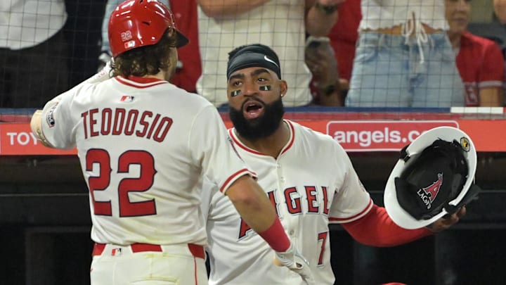 Sep 23, 2025; Anaheim, California, USA; Los Angeles Angels center fielder Bryce Teodosio (22) is congratulated by right fielder Jo Adell (7) after hitting a two-run shot for his first major league home run scoring second baseman Christian Moore (4) during the fifth inning against the Kansas City Royals at Angel Stadium. Mandatory Credit: Jayne Kamin-Oncea-Imagn Images Sep 23, 2025; Anaheim, California, USA; Los Angeles Angels center fielder Bryce Teodosio (22) is congratulated by right fielder Jo Adell (7) after hitting a two-run shot for his first major league home run scoring second baseman Christian Moore (4) during the fifth inning against the Kansas City Royals at Angel Stadium. Mandatory Credit: Jayne Kamin-Oncea-Imagn Images