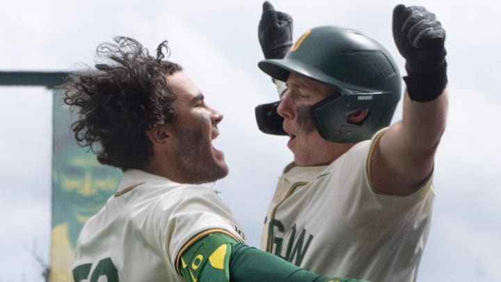 Oregon’s Angel Laya, left, celebrates his second home run of the game with Burke-Lee Mabeus during the game against Nebraska at PK Park in Eugene April 12, 2026.