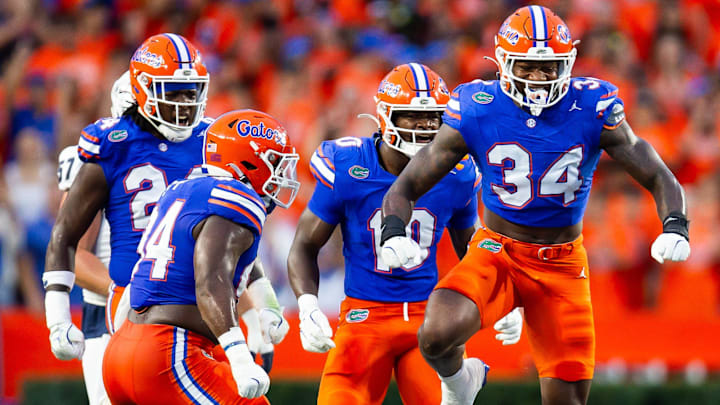 Florida Gators edge George Gumbs Jr. (34) celebrates tackling Samford Bulldogs wide receiver E. Jai Mason (3) during the first half at Ben Hill Griffin Stadium in Gainesville, FL on Saturday, September 7, 2024 against the Samford Bulldogs. [Doug Engle/Gainesville Sun]