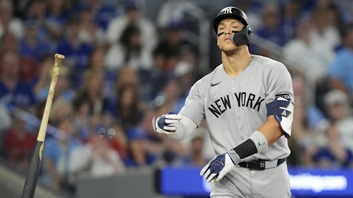 Oct 5, 2025; Toronto, Ontario, CAN; New York Yankees right fielder Aaron Judge (99) reacts after a walk in the ninth inning against the Toronto Blue Jays during game two of the ALDS round for the 2025 MLB playoffs at Rogers Centre. Mandatory Credit: John E. Sokolowski-Imagn Images