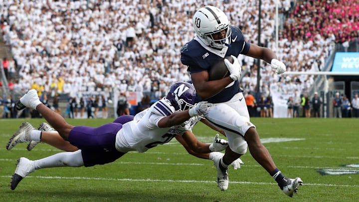 Penn State Nittany Lions running back Nicholas Singleton breaks a tackle to score a touchdown vs. the Northwestern Wildcats at Beaver Stadium. Penn State Nittany Lions running back Nicholas Singleton breaks a tackle to score a touchdown vs. the Northwestern Wildcats at Beaver Stadium.