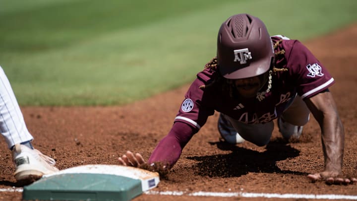Texas A&M Aggies' Terrence Kiel II dives safely into first base as Auburn Tigers take on Texas A&M Aggies during the SEC baseball tournament at Hoover Met in Birmingham, Ala., on Thursday, May 22, 2025. Texas A&M Aggies' Terrence Kiel II dives safely into first base as Auburn Tigers take on Texas A&M Aggies during the SEC baseball tournament at Hoover Met in Birmingham, Ala., on Thursday, May 22, 2025.