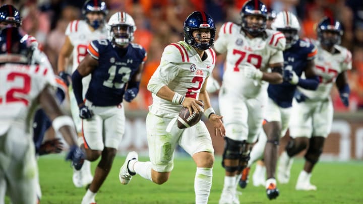 Mississippi Rebels quarterback Jaxson Dart (2) runs the ball as Auburn Tigers take on Mississippi Rebels at Jordan-Hare Stadium in Auburn, Ala., on Saturday, Oct. 21, 2023.