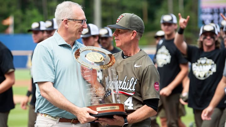 SEC Commissioner Greg Sankey presents the trophy to Vanderbilt Commodores head coach Tim Corbin as Ole Miss Rebels take on Vanderbilt Commodores during the SEC baseball tournament championship game at Hoover Met in Birmingham, Ala., on Sunday, May 25, 2025. Vanderbilt Commodores defeated Ole Miss Rebels 3-2. SEC Commissioner Greg Sankey presents the trophy to Vanderbilt Commodores head coach Tim Corbin as Ole Miss Rebels take on Vanderbilt Commodores during the SEC baseball tournament championship game at Hoover Met in Birmingham, Ala., on Sunday, May 25, 2025. Vanderbilt Commodores defeated Ole Miss Rebels 3-2.