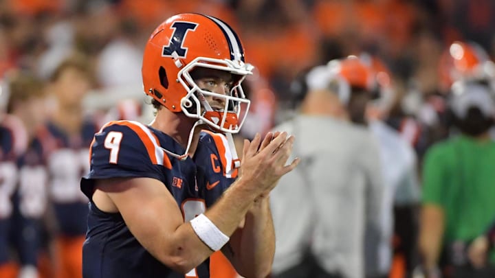 Sep 13, 2025; Champaign, Illinois, USA;  Illinois Fighting Illini quarterback Luke Altmyer (9) applauds teammates during the second half against the Western Michigan Broncos at Memorial Stadium. Mandatory Credit: Ron Johnson-Imagn Images