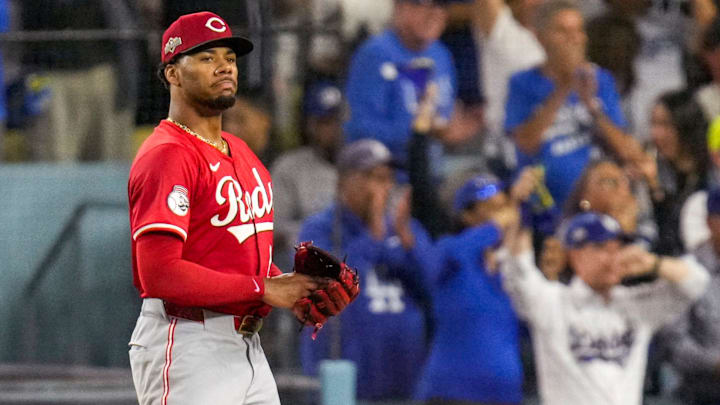 Cincinnati Reds starting pitcher Hunter Greene (21) reacts as Los Angeles Dodgers right fielder Teoscar Hernandez (37) runs the bases on a three-run home run in the third inning of the MLB National League Wild Card Game 1 between the Los Angeles Dodgers and the Cincinnati Reds at Dodger Stadium in Los Angeles on Tuesday, Sept. 30, 2025. The Dodgers won game 1 of the series, 10-5.
