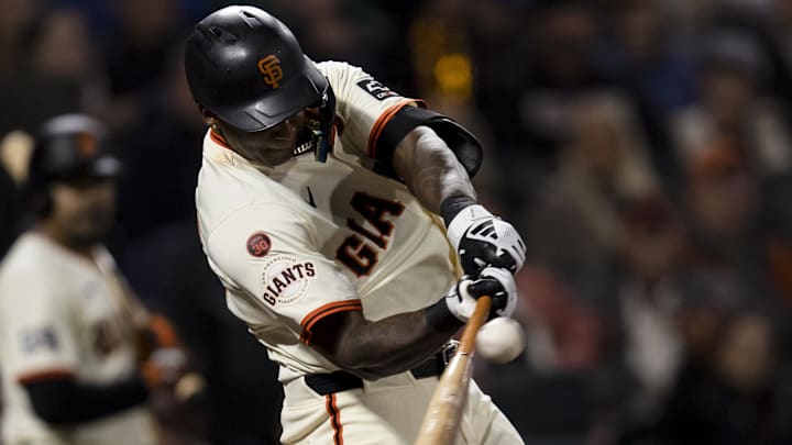 Sep 11, 2024; San Francisco, California, USA; San Francisco Giants shortstop Marco Luciano (37) hits a single against the Milwaukee Brewers during the eighth inning at Oracle Park. 