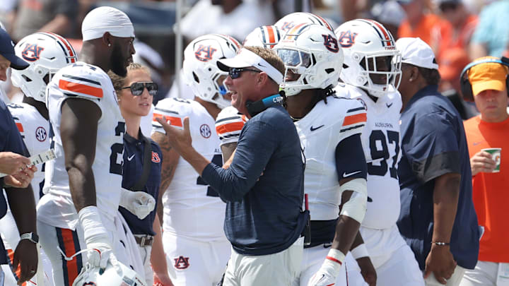 Sep 13, 2025; Auburn, Alabama, USA; Auburn Tigers head coach Hugh Freeze talks with defensive end Keyron Crawford (24) during the second quarter against the South Alabama Jaguars at Jordan-Hare Stadium. Mandatory Credit: John Reed-Imagn Images