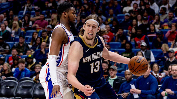 Mar 24, 2025; New Orleans, Louisiana, USA;  New Orleans Pelicans forward Kelly Olynyk (13) dribbles against Philadelphia 76ers forward Justin Edwards (19) during the second half at Smoothie King Center. Mandatory Credit: Stephen Lew-Imagn Images