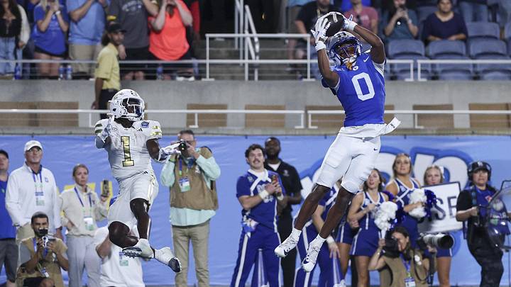 Dec 27, 2025; Orlando, FL, USA; BYU Cougars defensive back Evan Johnson (0) intercepts the ball in the end zone from Georgia Tech Yellow Jackets running back Jamal Haynes (1) to end the Pop-Tarts Bowl at Camping World Stadium. Mandatory Credit: Nathan Ray Seebeck-Imagn Images Dec 27, 2025; Orlando, FL, USA; BYU Cougars defensive back Evan Johnson (0) intercepts the ball in the end zone from Georgia Tech Yellow Jackets running back Jamal Haynes (1) to end the Pop-Tarts Bowl at Camping World Stadium. Mandatory Credit: Nathan Ray Seebeck-Imagn Images