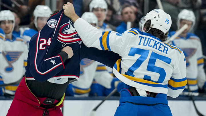 Nov 1, 2025; Columbus, Ohio, USA;  Columbus Blue Jackets right wing Mathieu Olivier (24) fights St. Louis Blues defenseman Tyler Tucker (75) in the first period at Nationwide Arena. Mandatory Credit: Aaron Doster-Imagn Images