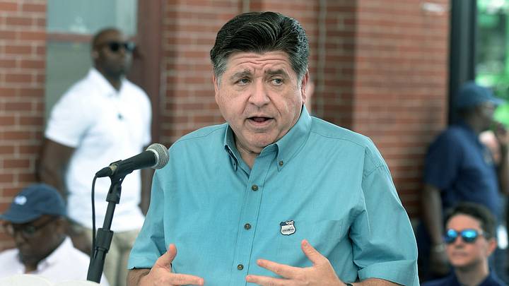 Gov. JB Pritzker answers questions from the press just outside the Main Gate following the ceremonial ribbon cutting to kick off the Illinois State Fair Aug. 13, 2026, in Springfield.