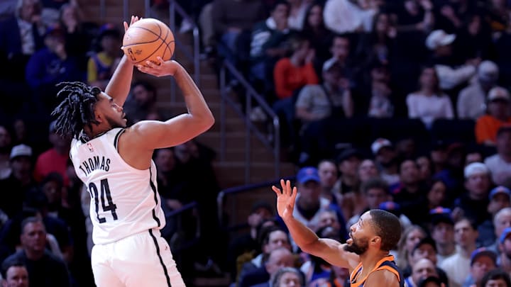 Nov 15, 2024; New York, New York, USA; Brooklyn Nets guard Cam Thomas (24) takes a shot against New York Knicks forward Mikal Bridges (25) during the fourth quarter at Madison Square Garden. Mandatory Credit: Brad Penner-Imagn Images