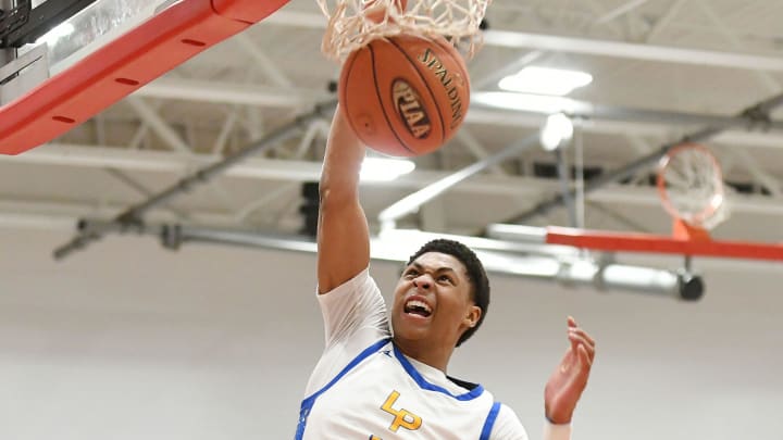 Lincoln Park   s Meleek Thomas dunks the ball during Friday   s PIAA Class 4A quarterfinal game against North Catholic at Fox Chapel High School.