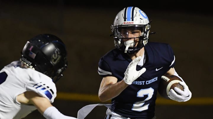 Christ Church's Jackson Repp (2) seeks to avoid a tackle in a contest against St. Joseph's Catholic on Nov. 24, 2023. Christ Church won the game 53-20.