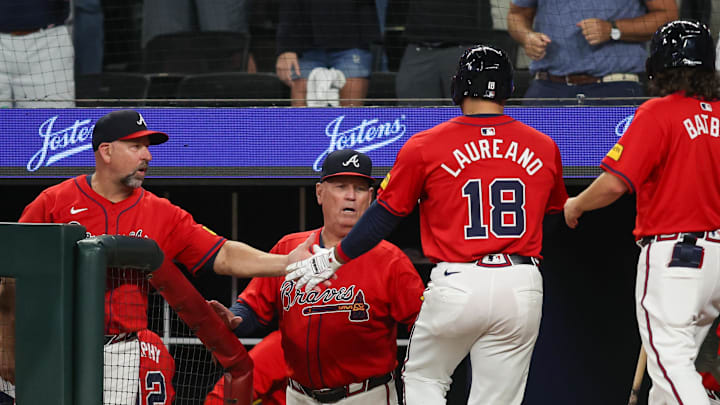 Atlanta Braves left fielder Ramon Laureano with bench coach Walt Weiss and manager Brian Snitker 