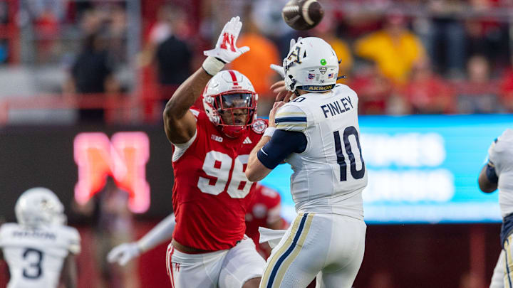 Nebraska defensive lineman Conor Connealy pressures Akron quarterback Ben Finley.