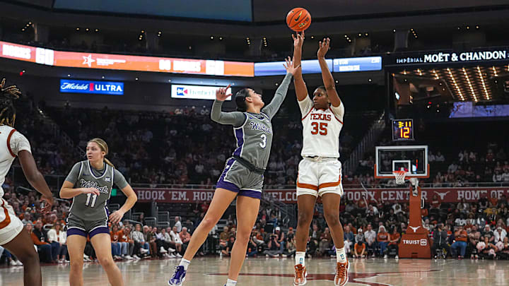 Texas Longhorns guard Madison Booker (35) shoots over Kansas State guard Jaelyn Glenn (3) during the