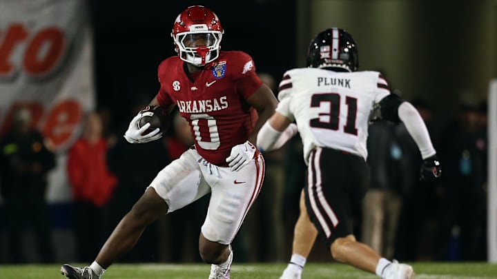 Arkansas Razorbacks running back Braylen Russell (0) runs the ball during the third quarter against the Texas Tech Red Raiders at Simmons Bank Liberty Stadium.