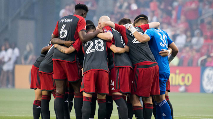 Toronto FC players huddle before the MLS game between...