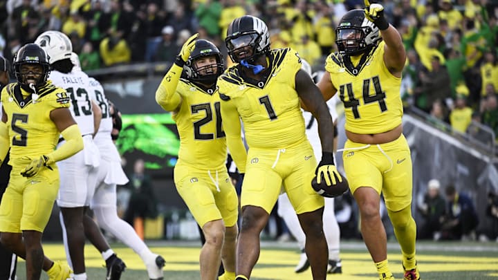 Oct 4, 2024; Eugene, Oregon, USA; Oregon Ducks defensive end Jordan Burch (1) celebrates with teammates linebacker Bryce Boettcher (28) and linebacker Teitum Tuioti (44) after recovering a fumble for a safety during the first half against the Michigan State Spartans at Autzen Stadium. Mandatory Credit: Troy Wayrynen-Imagn Images