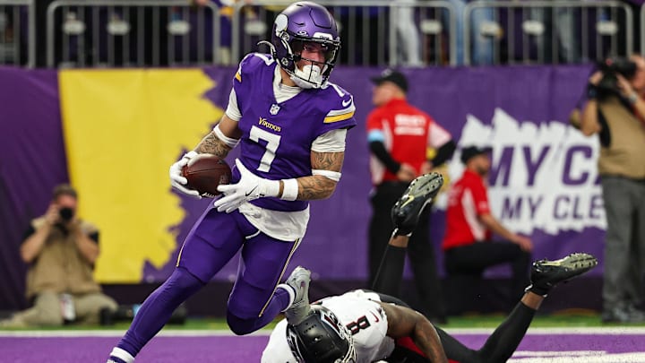Dec 8, 2024; Minneapolis, Minnesota, USA; Minnesota Vikings cornerback Byron Murphy Jr. (7) intercepts a pass intended for Atlanta Falcons tight end Kyle Pitts (8) during the fourth quarter at U.S. Bank Stadium.