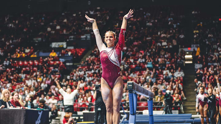 Lilly Hudson dismounts the beam against Oklahoma Lilly Hudson dismounts the beam against Oklahoma