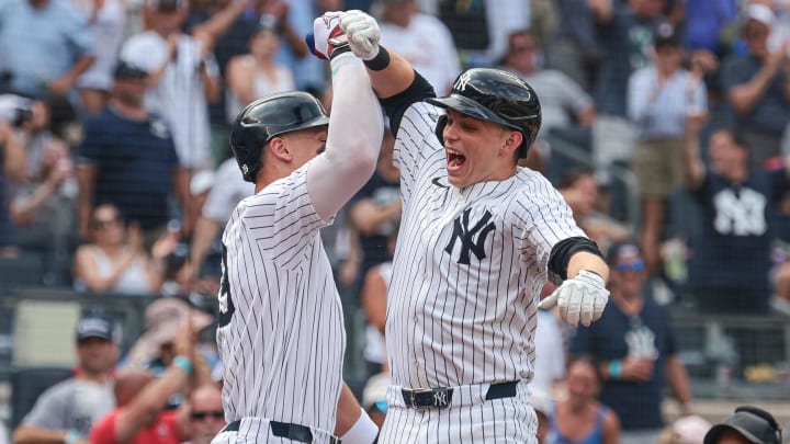 Jul 6, 2024; Bronx, New York, USA; New York Yankees first baseman Ben Rice (93) celebrates after his third home run of the game, a three run home run, with center fielder Aaron Judge (99) during the seventh inning against the Boston Red Sox at Yankee Stadium. Mandatory Credit: Vincent Carchietta-USA TODAY Sports