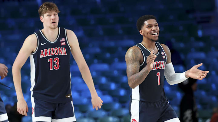Nov 27, 2024; Paradise Island, Bahamas, BHS; Arizona Wildcats guard Caleb Love (1) reacts with Arizona Wildcats forward Henri Veesaar (13) during the second half against the Davidson Wildcats at the Atlantis Resort. 