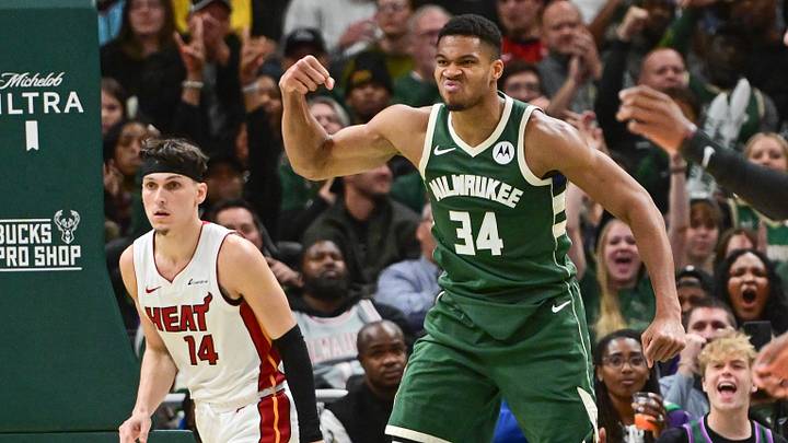 Oct 30, 2023; Milwaukee, Wisconsin, USA;  Milwaukee Bucks forward Giannis Antetokounmpo (34) reacts after scoring a basket as Miami Heat guard Tyler Herro (14) looks on in the fourth quarter at Fiserv Forum. Mandatory Credit: Benny Sieu-Imagn Images