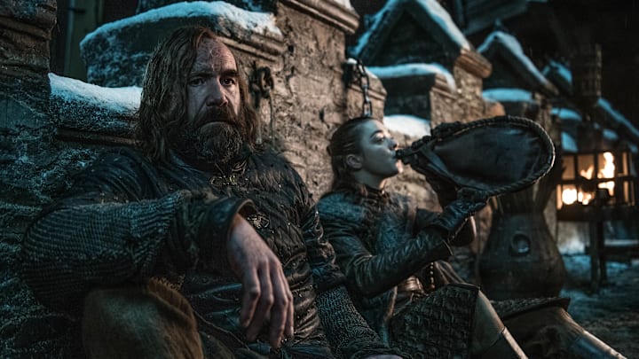 (L to R) Rory McCann as Sandor “The Hound” Clegane and Maisie Williams as Arya Stark – Photo: Helen Sloan/HBO