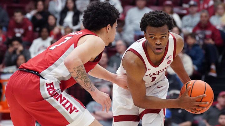 Dec 7, 2025; Stanford, California, USA;  Stanford Cardinal guard Ebuka Okorie (1) dribbles upcourt while defended by UNLV Runnin' Rebels guard Al Green (7) in the first half at Maples Pavilion. Mandatory Credit: David Gonzales-Imagn Images