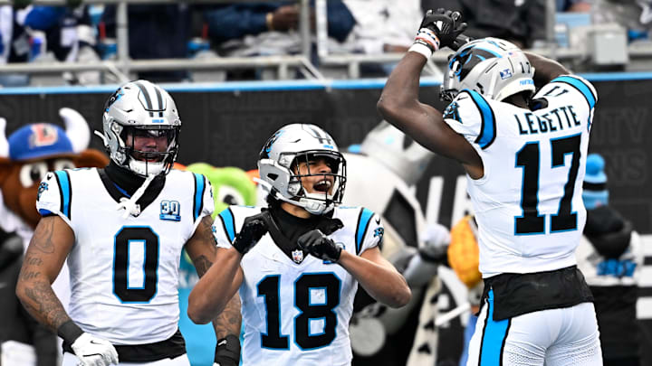 Dec 15, 2024; Charlotte, North Carolina, USA; Carolina Panthers wide receiver Jalen Coker (18) celebrates with tight end Ja'Tavion Sanders (0) and wide receiver Xavier Legette (17) after scoring a touchdown in the second quarter at Bank of America Stadium. Mandatory Credit: Bob Donnan-Imagn Images Dec 15, 2024; Charlotte, North Carolina, USA; Carolina Panthers wide receiver Jalen Coker (18) celebrates with tight end Ja'Tavion Sanders (0) and wide receiver Xavier Legette (17) after scoring a touchdown in the second quarter at Bank of America Stadium. Mandatory Credit: Bob Donnan-Imagn Images