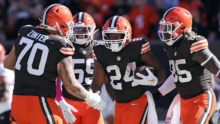 Cleveland Browns running back Nick Chubb (24) celebrates his rushing touchdown with guard Zak Zinter (70) and tight end David Njoku (85) during the first half of an NFL football game against the Cincinnati Bengals at Huntington Bank Field, Sunday, Oct. 20, 2024, in Cleveland, Ohio.