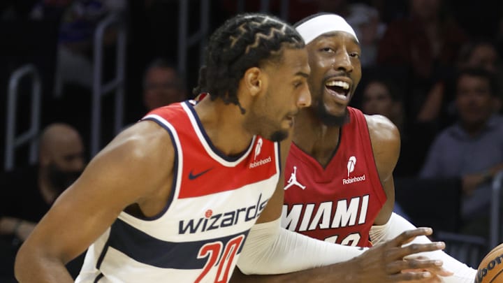 Mar 10, 2026; Miami, Florida, USA;  Washington Wizards center Alex Sarr (20) defends Miami Heat center Bam Adebayo (13) during the first half at Kaseya Center. Mandatory Credit: Rhona Wise-Imagn Images