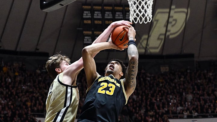 Feb 17, 2026; West Lafayette, Indiana, USA; Purdue Boilermakers center Daniel Jacobsen (12) blocks a shot by Michigan Wolverines forward Yaxel Lendeborg (23) during the first half at Mackey Arena. Mandatory Credit: Marc Lebryk-Imagn Images Feb 17, 2026; West Lafayette, Indiana, USA; Purdue Boilermakers center Daniel Jacobsen (12) blocks a shot by Michigan Wolverines forward Yaxel Lendeborg (23) during the first half at Mackey Arena. Mandatory Credit: Marc Lebryk-Imagn Images