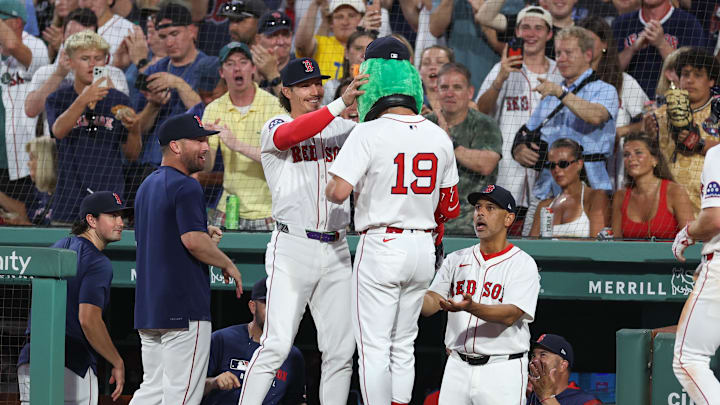 Jul 7, 2025; Boston, Massachusetts, USA; Boston Red Sox designated hitter Roman Anthony (19) celebrates with Boston Red Sox left fielder Jarren Duran (16) after hitting a two run home run during the fifth inning against the Colorado Rockies at Fenway Park. Mandatory Credit: Paul Rutherford-Imagn Images
