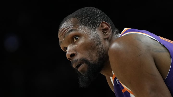 Mar 17, 2025; Phoenix, Arizona, USA; Phoenix Suns forward Kevin Durant (35) during a timeout in the second half against the Toronto Raptors at Footprint Center. Mandatory Credit: Rick Scuteri-Imagn Images