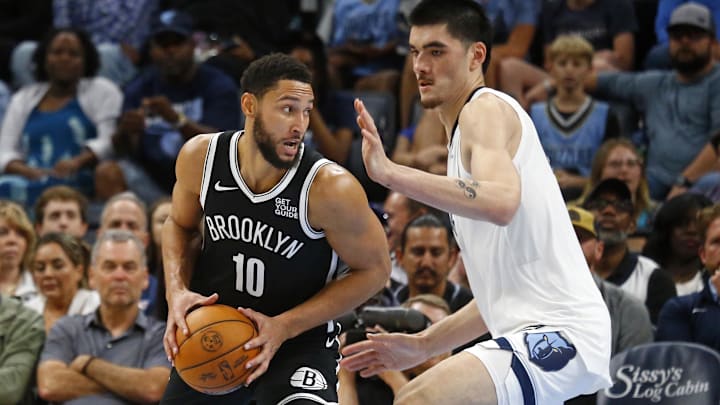 Oct 30, 2024; Memphis, Tennessee, USA; Brooklyn Nets guard Ben Simmons (10) drives to the basket as Memphis Grizzlies center Zach Edey (14) defends during the second half at FedExForum. Mandatory Credit: Petre Thomas-Imagn Images