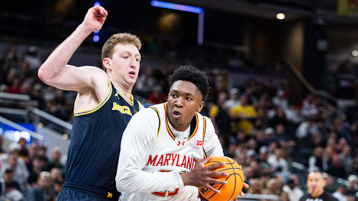 Mar 15, 2025; Indianapolis, IN, USA; Maryland Terrapins center Derik Queen (25) dribbles the ball while Michigan Wolverines center Danny Wolf (1) defends in the second half at Gainbridge Fieldhouse. Mandatory Credit: Trevor Ruszkowski-Imagn Images Mar 15, 2025; Indianapolis, IN, USA; Maryland Terrapins center Derik Queen (25) dribbles the ball while Michigan Wolverines center Danny Wolf (1) defends in the second half at Gainbridge Fieldhouse. Mandatory Credit: Trevor Ruszkowski-Imagn Images