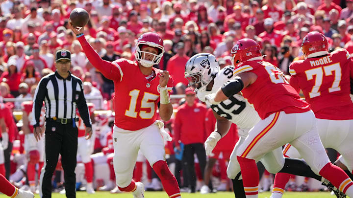 Oct 19, 2025; Kansas City, Missouri, USA; Kansas City Chiefs quarterback Patrick Mahomes (15) passes the ball against the Las Vegas Raiders during the second quarter of the game at GEHA Field at Arrowhead Stadium. Mandatory Credit: Denny Medley-Imagn Images