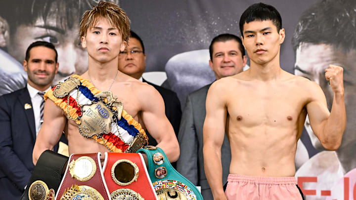 Naoya Inoue (L) of Japan and Kim Ye-joon of South Korea pose during the official weigh-in ahead of their world super-bantamweight title boxing bout in Yokohama, Kanagawa, Japan on January 23, 2025