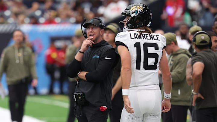 Nov 9, 2025; Houston, Texas, USA; Jacksonville Jaguars head coach Liam Coen and quarterback Trevor Lawrence (16) on the sidelines during the first half against the Houston Texans at NRG Stadium. Mandatory Credit: Thomas Shea-Imagn Images
